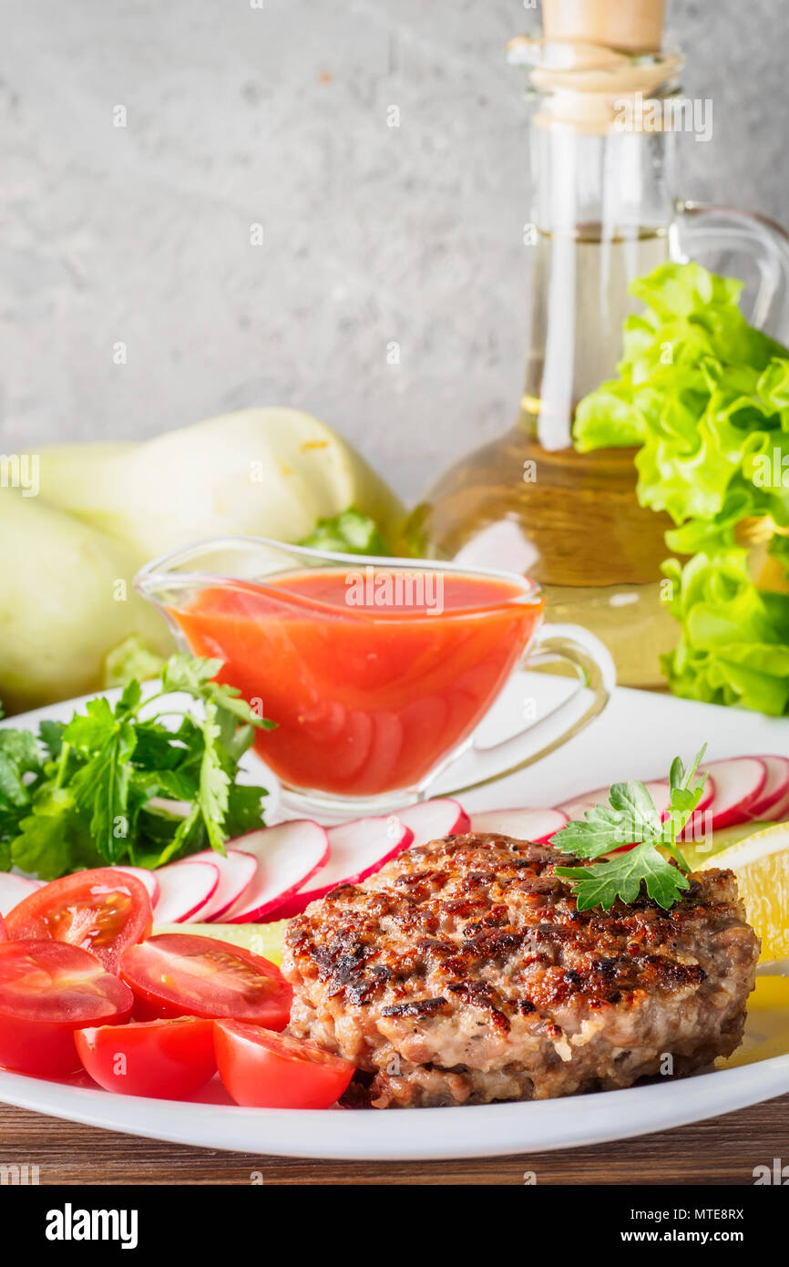 Chopped steak cutlet cooked on grill on white plate Stock Photo Alamy