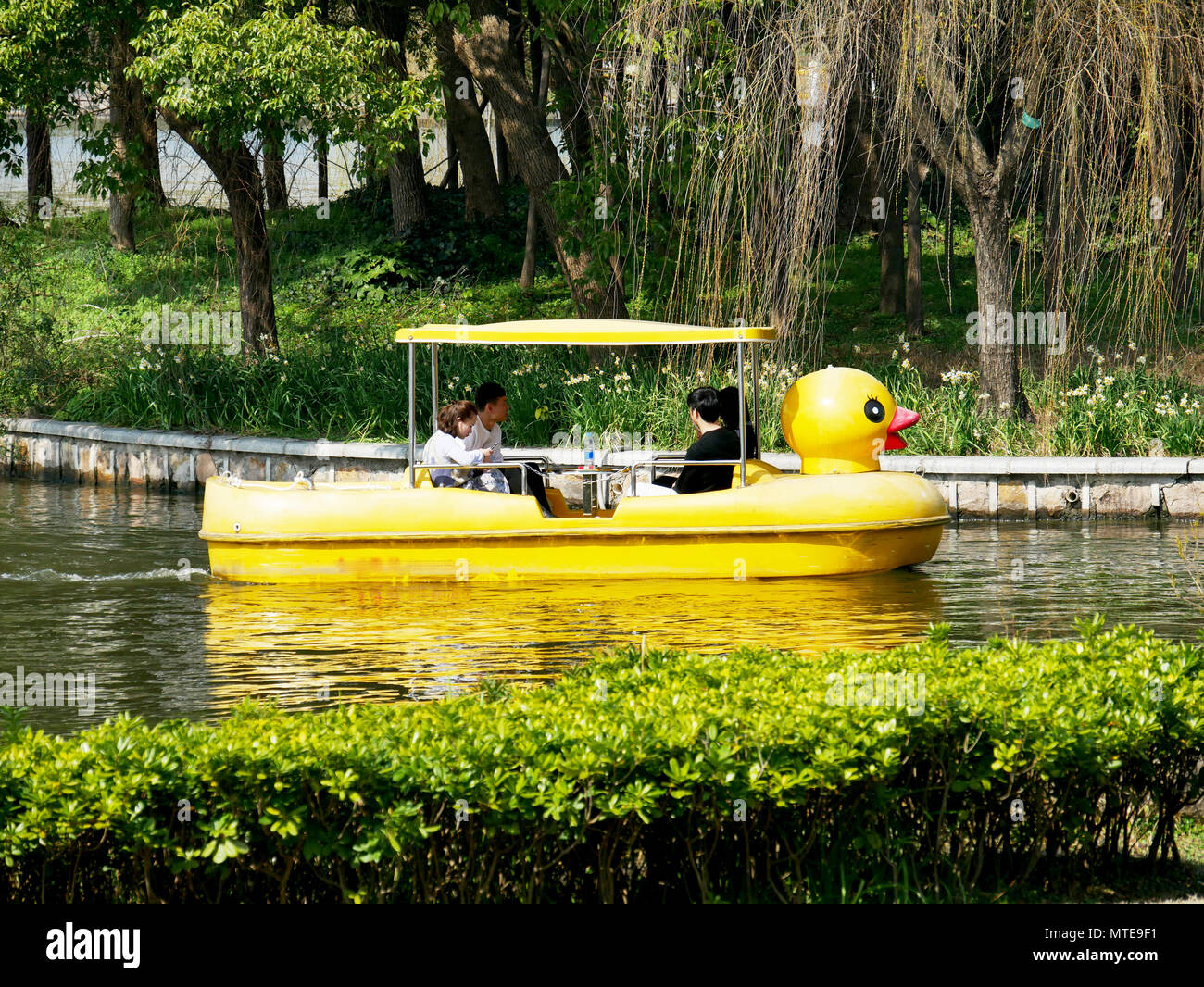 Chinese people enjoying the lake in a duck boat Stock Photo
