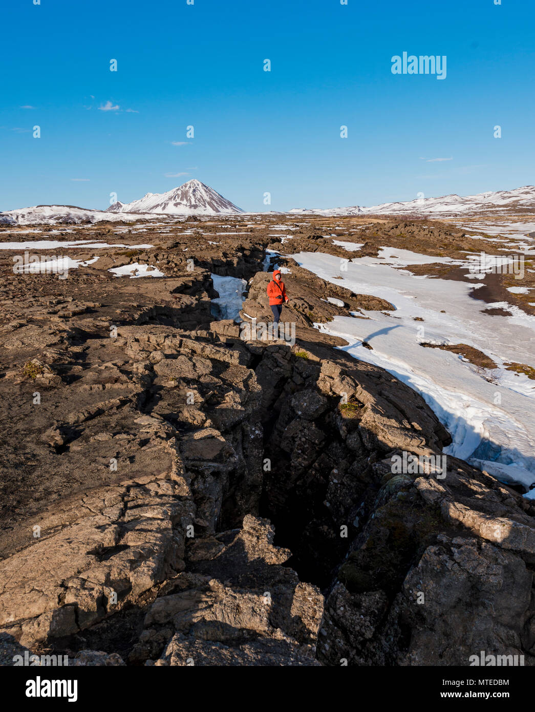 Man stands at Continental Rift between North American and Eurasian ...