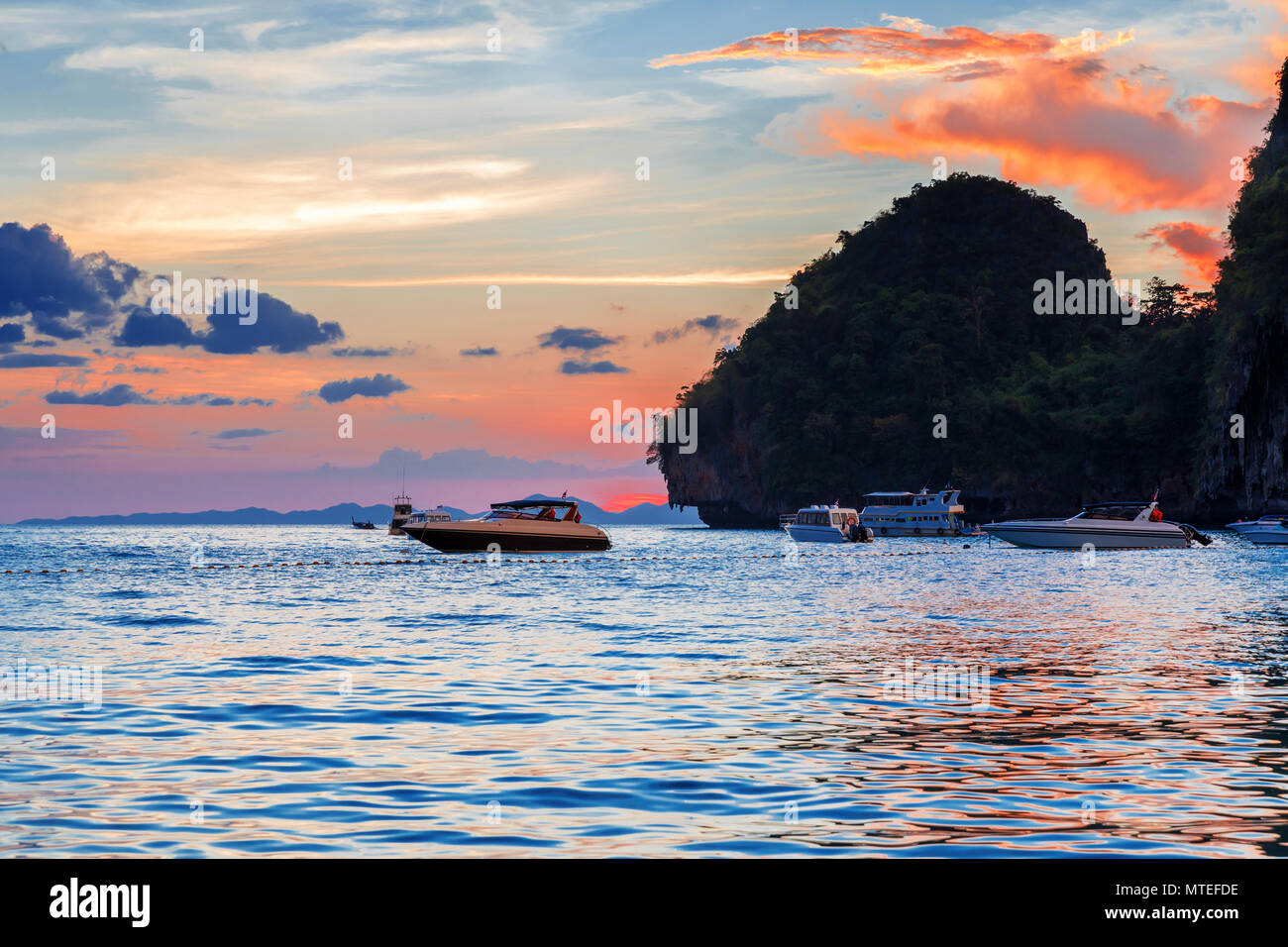 Popular travel tropical karst rocks perfect for climbing Phra Nang Cave Beach in sunset, Krabi province, Thailand Stock Photo