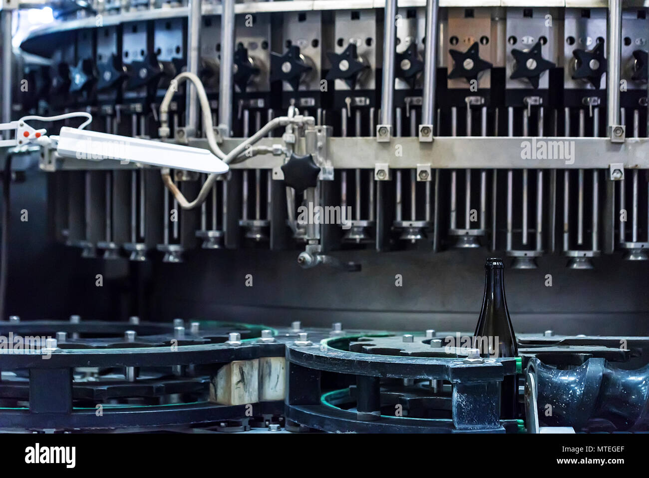 Wine bottle on corking conveyor at winery Stock Photo Alamy