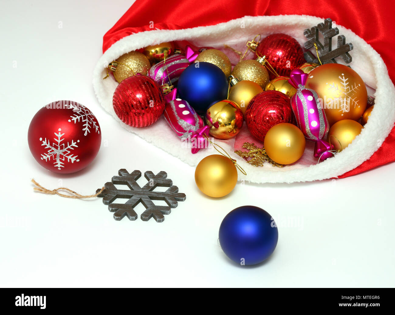 Christmas balls, toys in bag on white Stock Photo