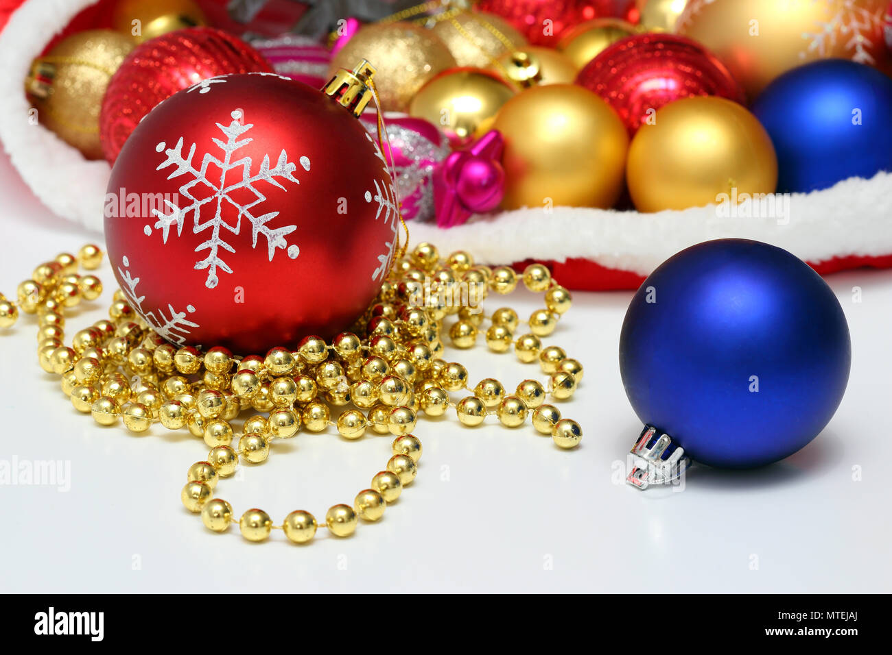 Christmas balls, toys, garland in red bag Stock Photo