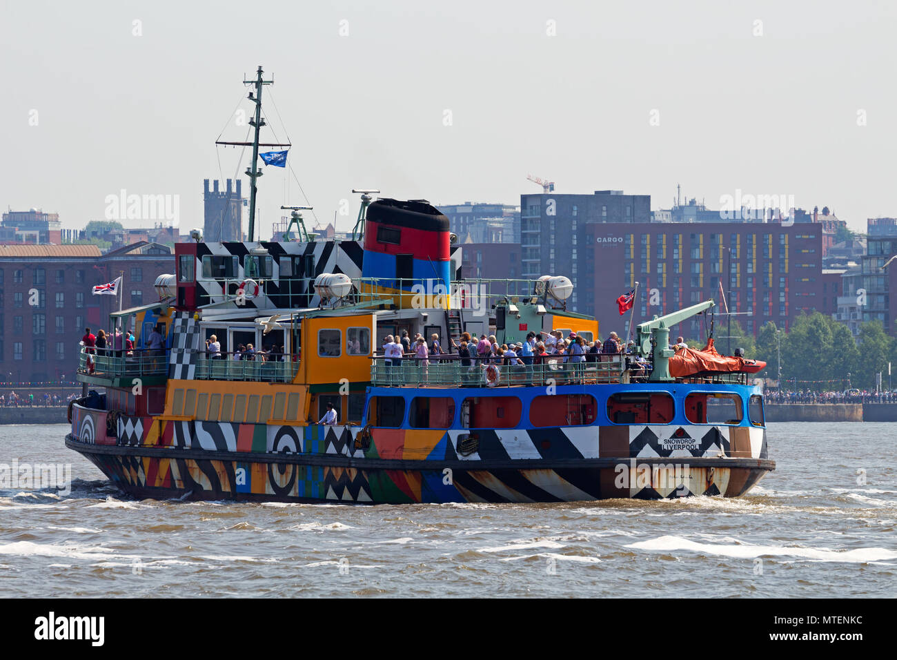 The Mersey Ferry Snowdrop in Razzle Dazzle livery sailing on the River Mersey in Liverpool UK