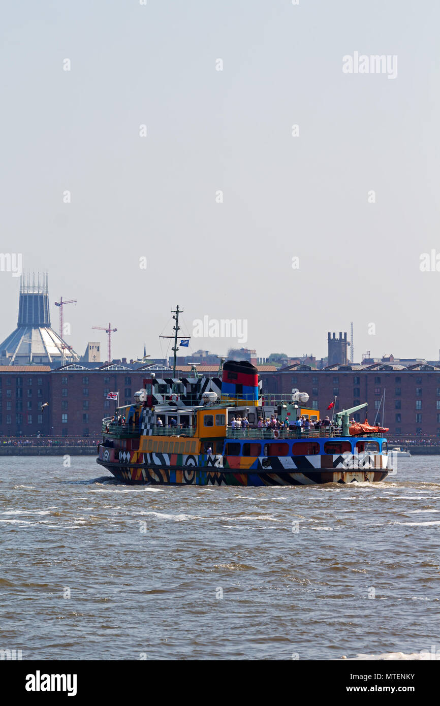 The Mersey Ferry Snowdrop in Razzle Dazzle livery sailing on the River Mersey in Liverpool UK