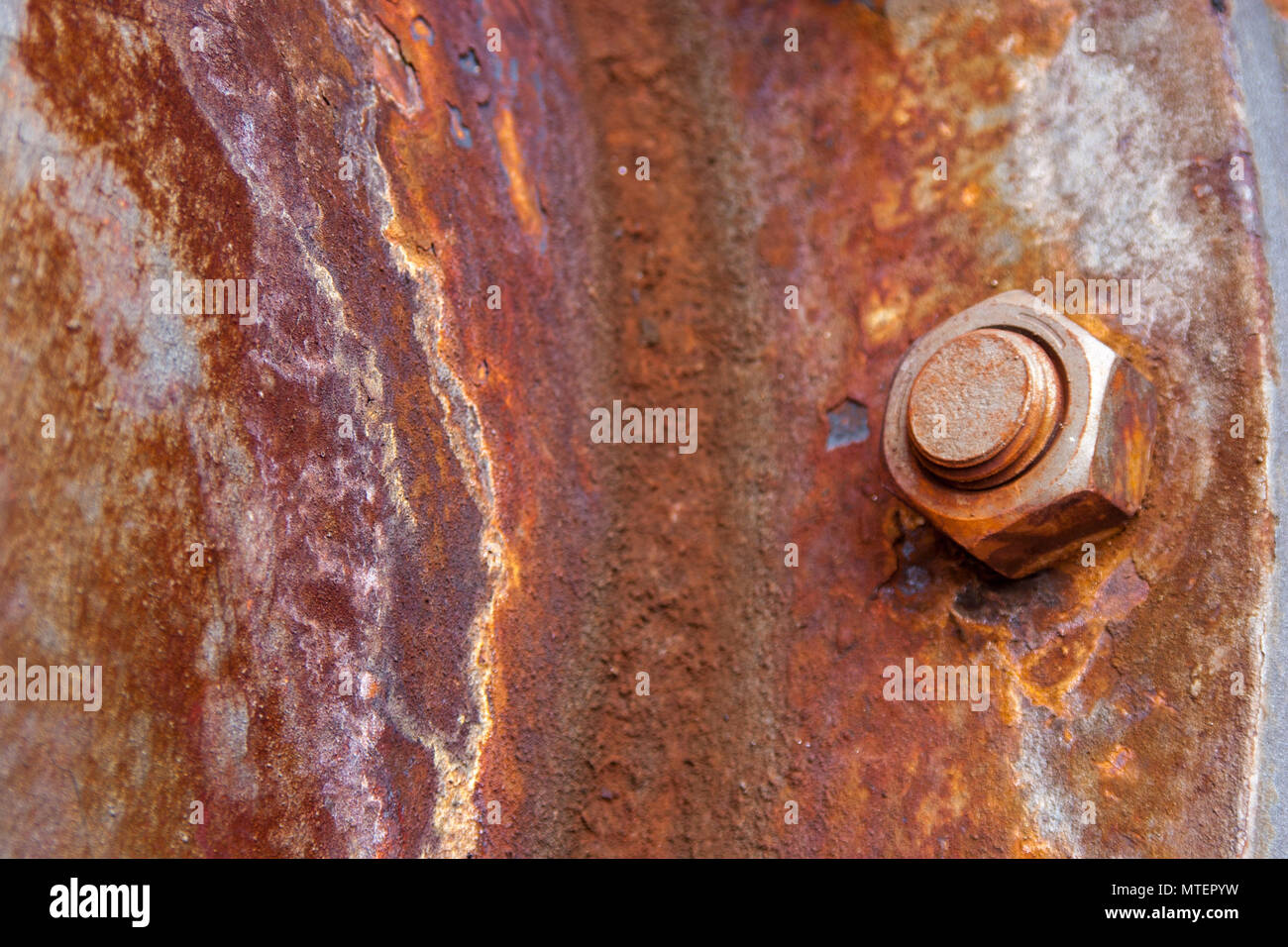 Rusted Old Iron Nut At The Surface Of Old Rusty Metal Plate Heavily
