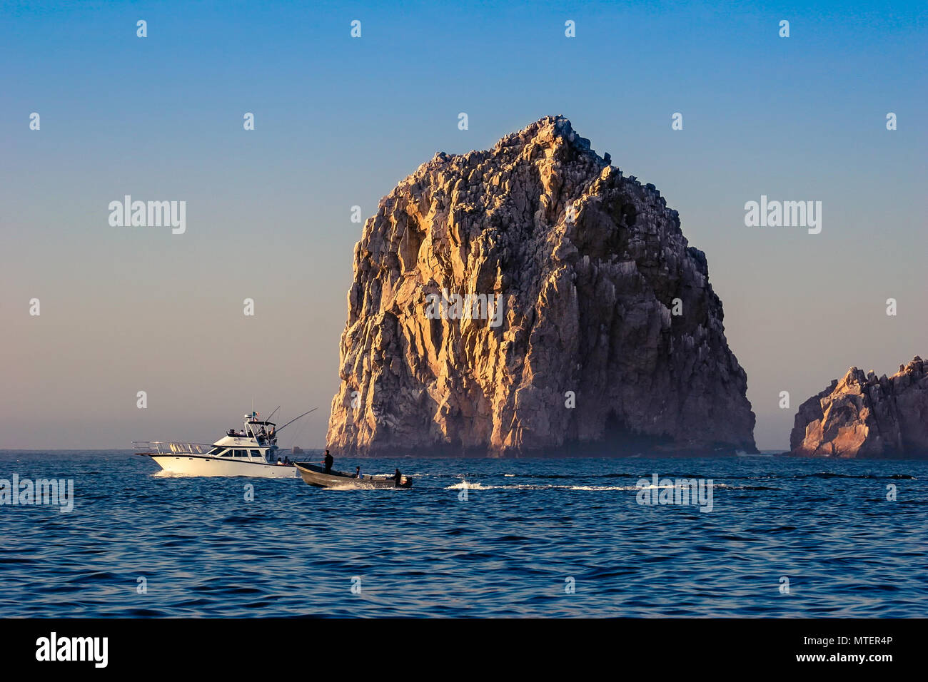 Yacht in sea next rock hi-res stock photography and images - Alamy