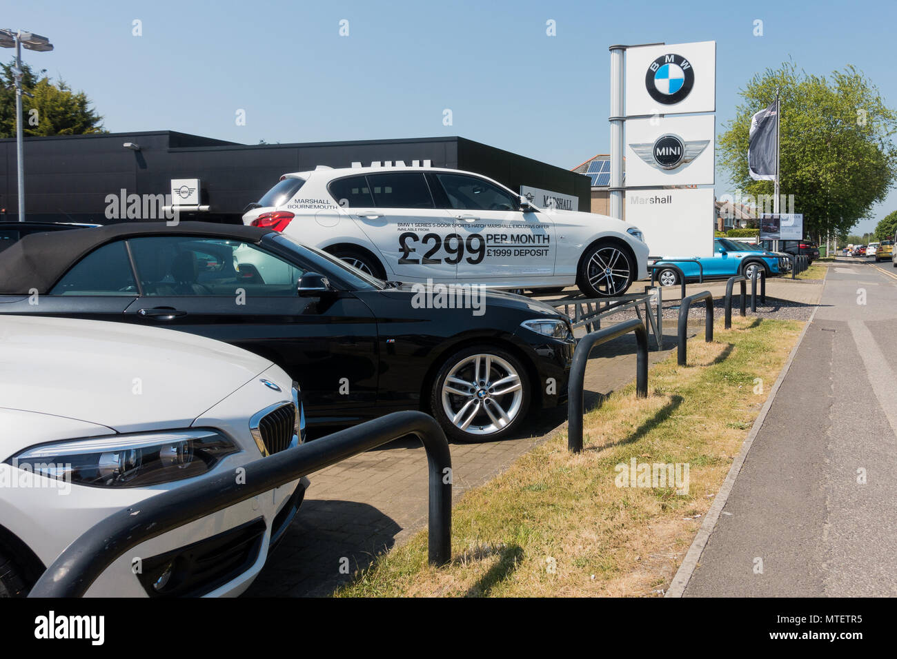 BMW cars for sale on a showroom forecourt, Marshall Motors, Bournemouth, Dorset, United Kingdom Stock Photo