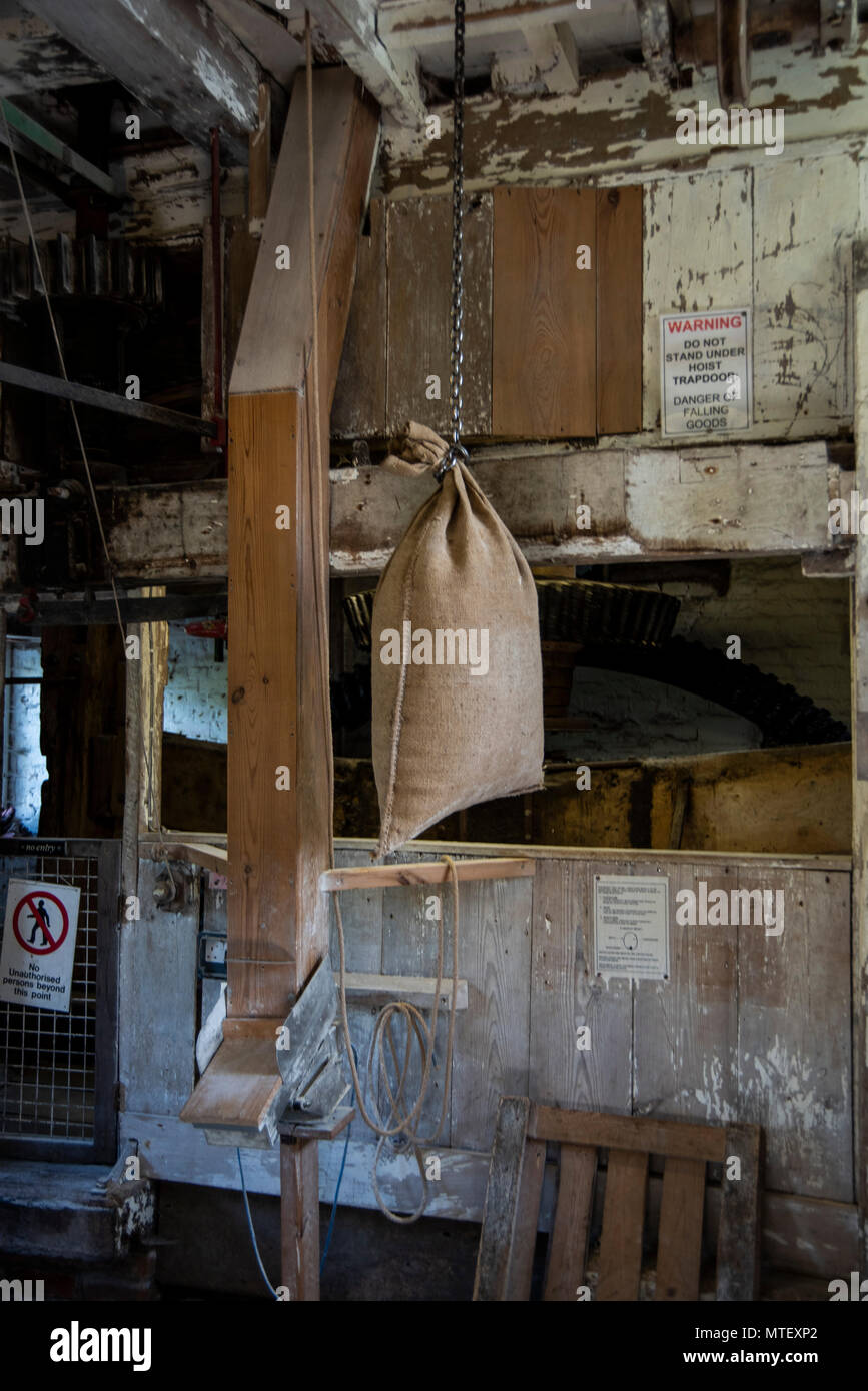 Pakenham Watermill, interior, in Suffolk U.K. grain sack being lifted. Stock Photo