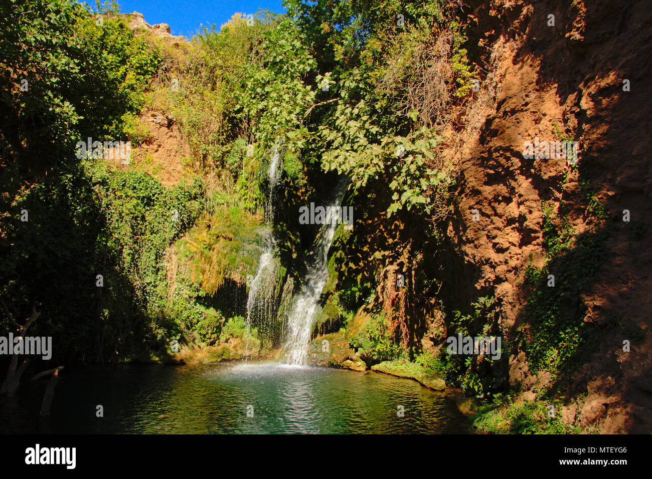 Idyllic Huesna waterfall and pond in San Nicolas Del Puerto, Sierra Norte de Sevilla Natural Park , Andalucia Spain Stock Photo