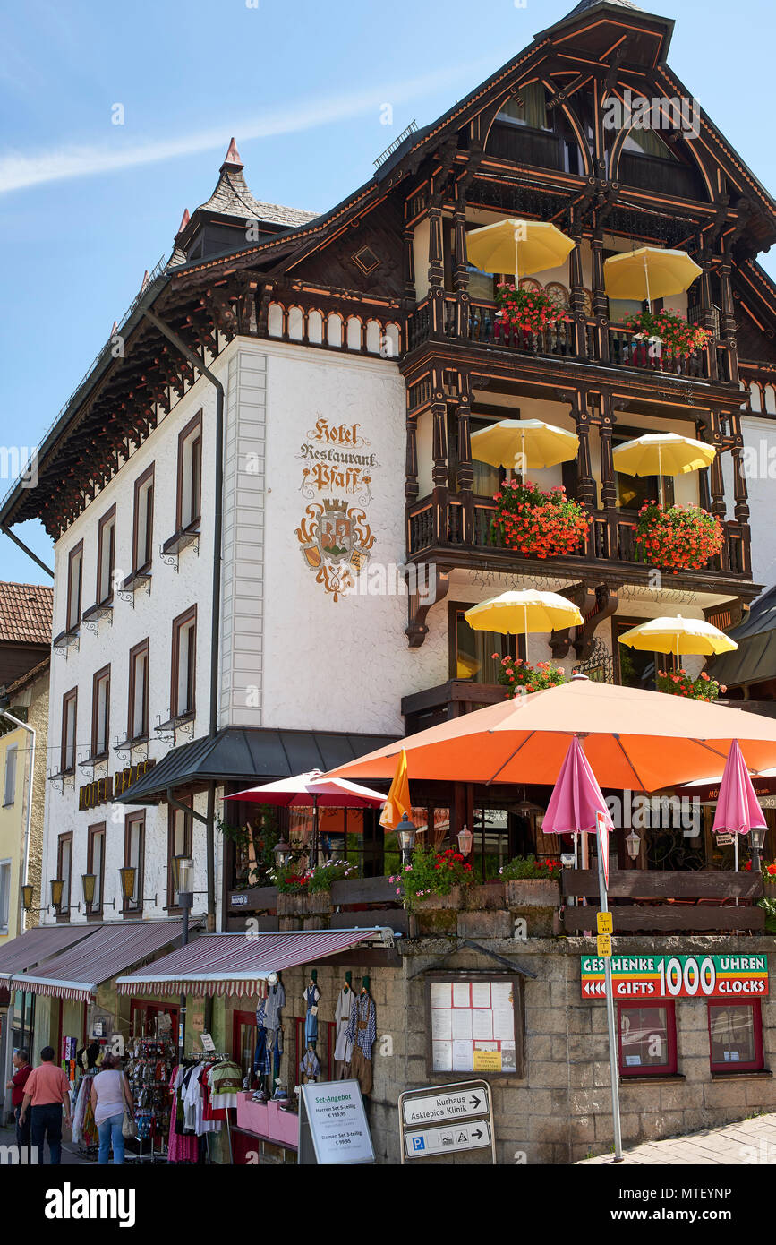 Hotel Pfaff, top of Triberg high street, colourful window boxes and shade unbrellas on the balconies Stock Photo