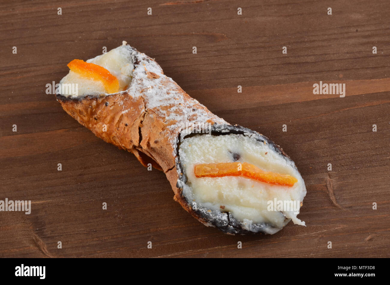 Dessert: Cannolo Siciliano .In a italian restaurant. Stock Photo
