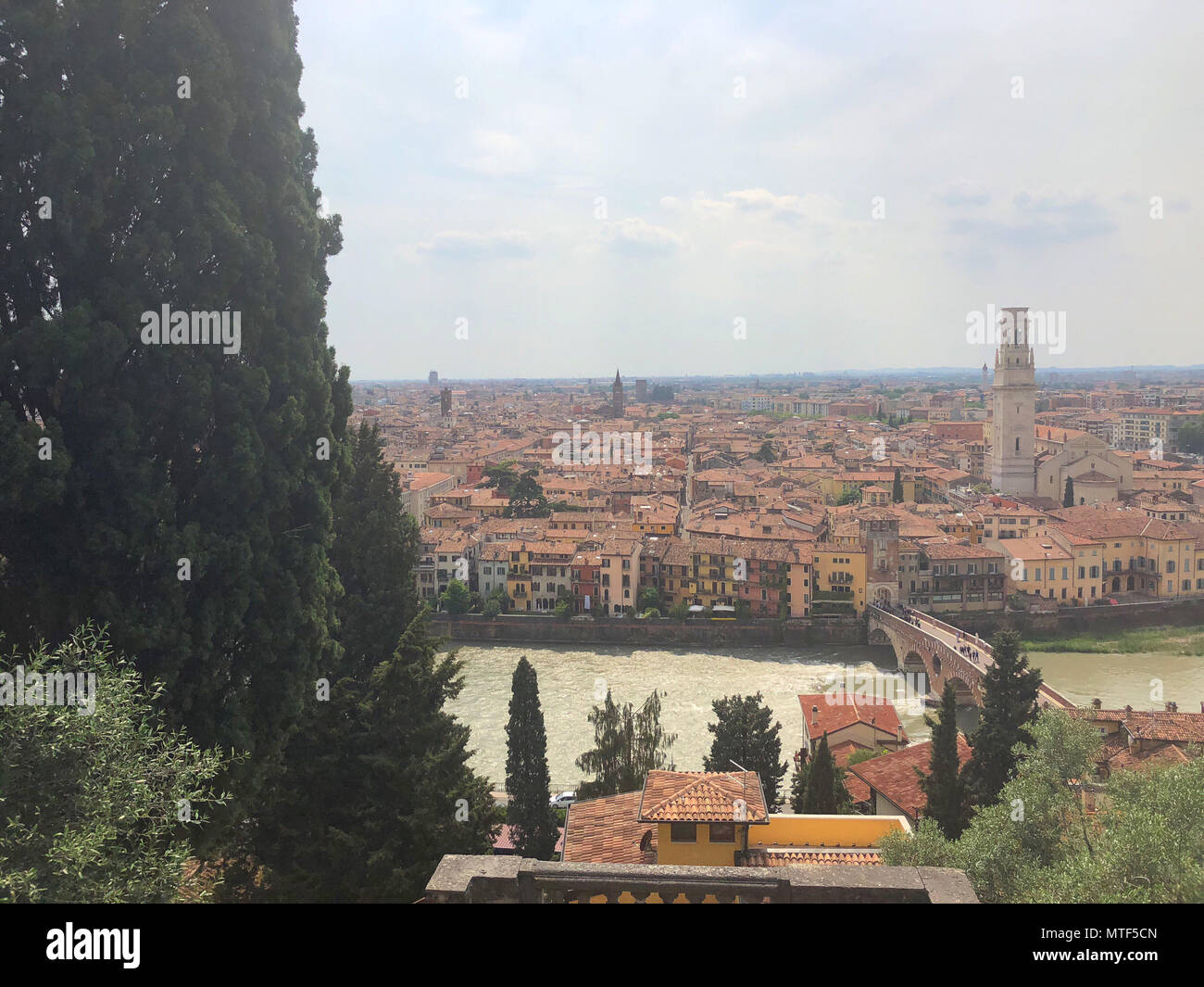 View of the Adige River as it passes through the houses and historical ...