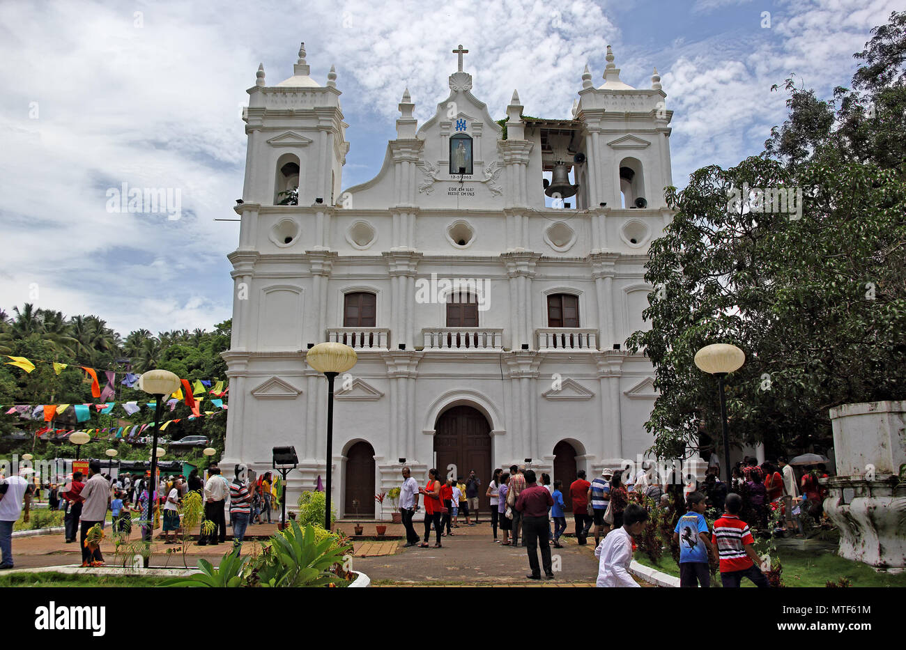ourists and locals participate in annual Patolienchem fest that showcases trades, crafts and culture of Goa at Our Lady of Succour Church in Socorro. Stock Photo