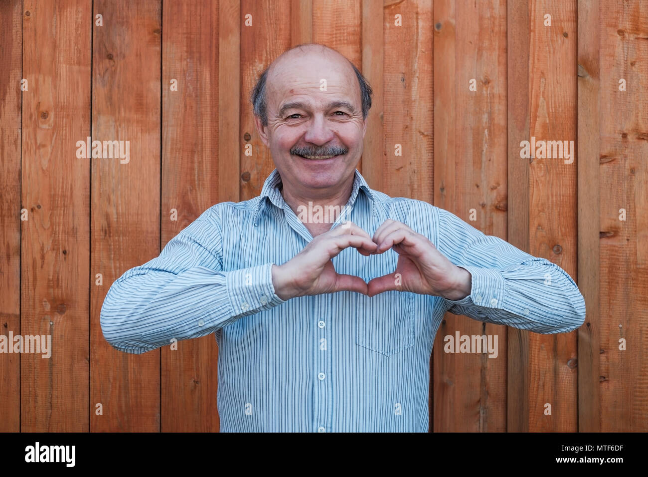man making a hand heart frame Stock Photo