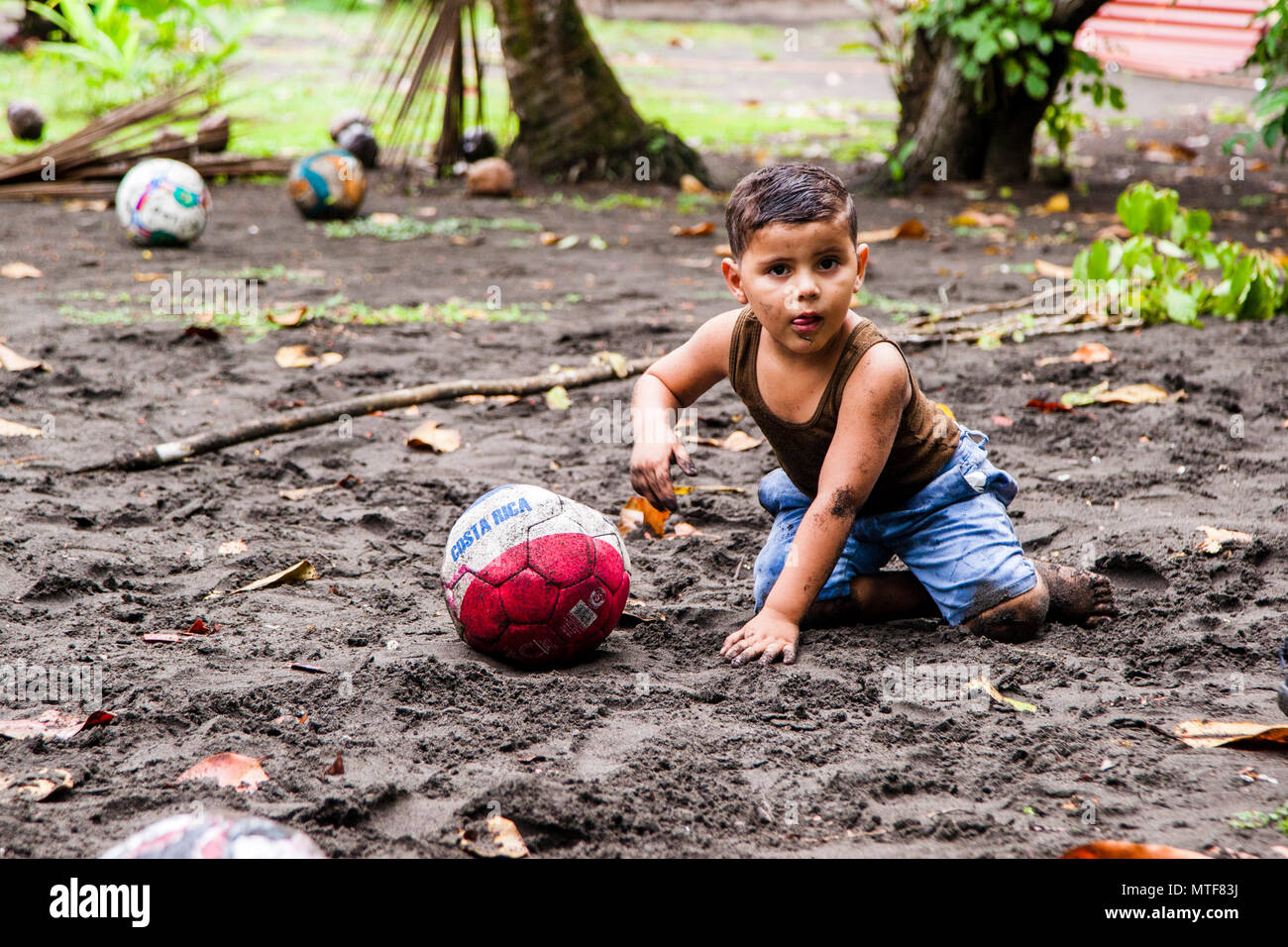 Local Children playing at the Biosphere Citizen Scientist Project Camp to save Sea Turtles in Reventazón, Costa Rica Stock Photo