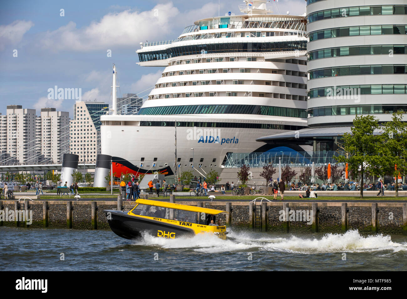 The skyline of Rotterdam, on the Nieuwe Maas, at the 'Kop van Zuid' district, Netherlands, Hotel New York, Aida Perla Cruise ship at the Cruise Termin Stock Photo