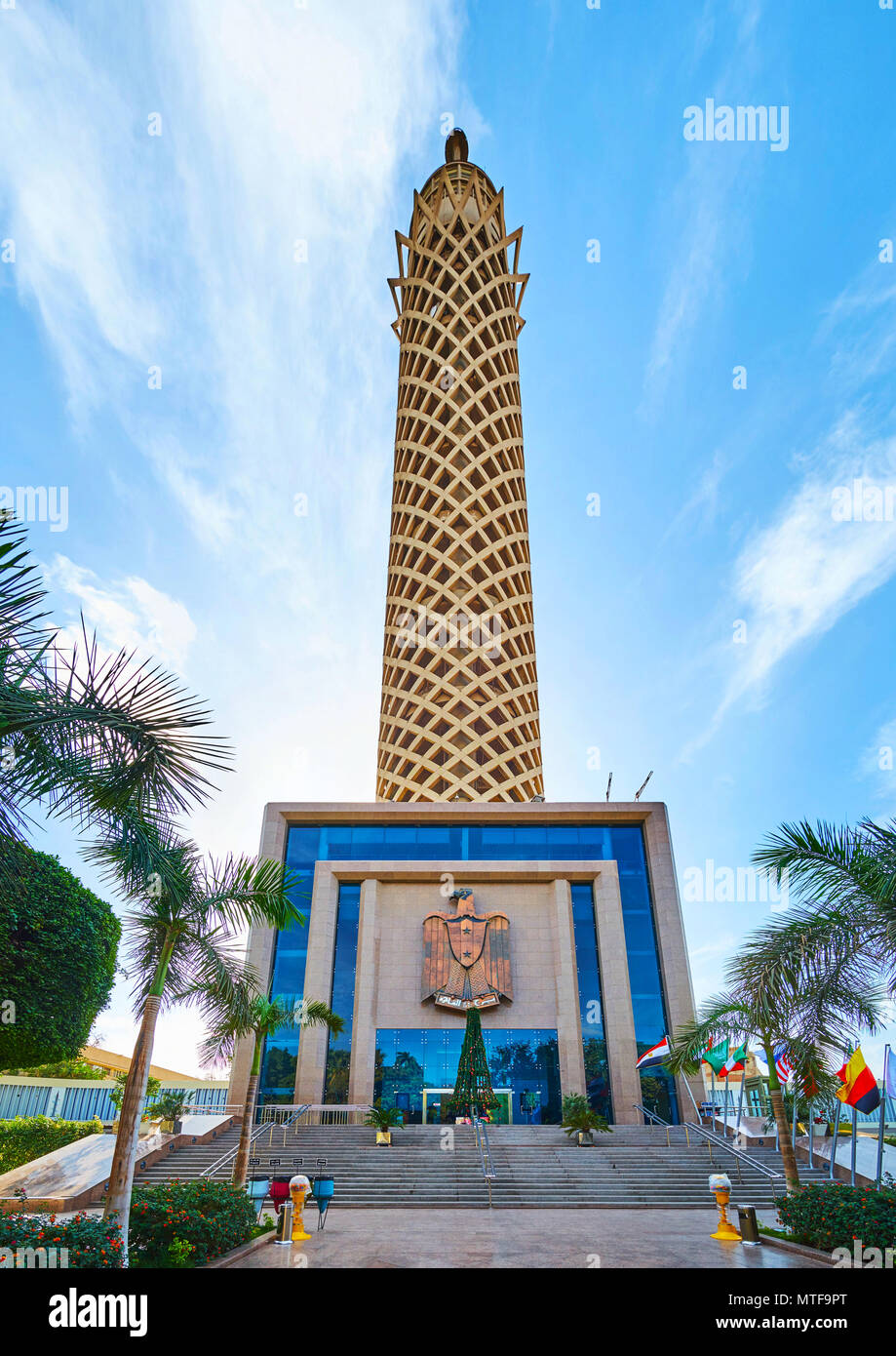 CAIRO, EGYPT - DECEMBER 24, 2017: The entrance to Cairo Tower, decorated with the State Emblem of Egypt - the eagle, and surrounded by garden, on Dece Stock Photo