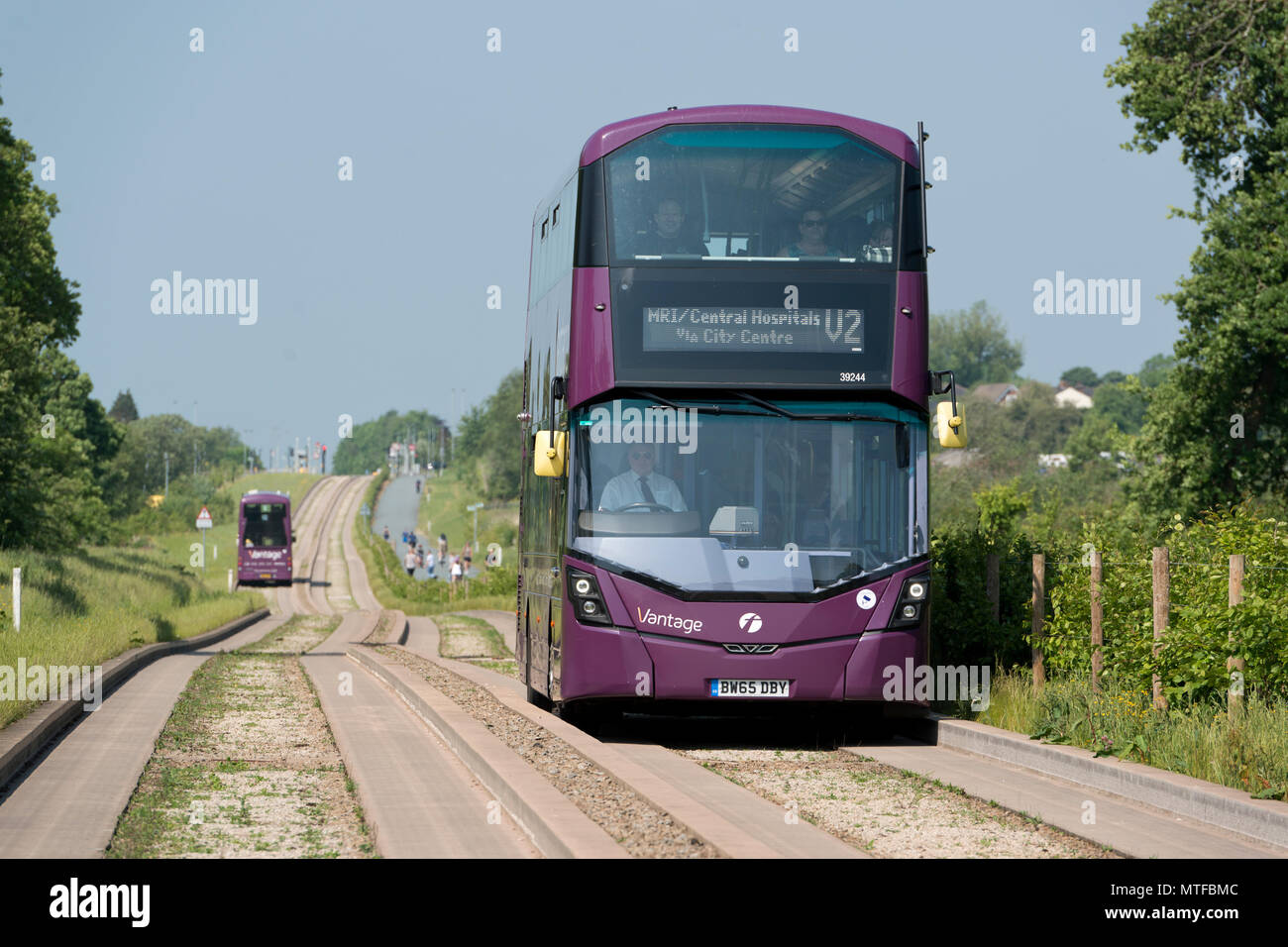 A First Vantage bus travels down the Leigh Guided Busway in Mosley Common, Wigan, Greater Manchester. Stock Photo