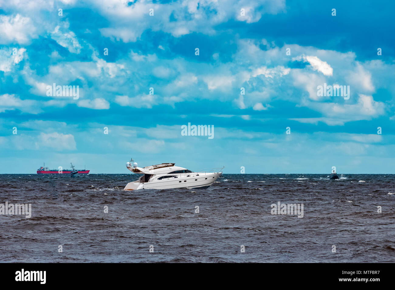 White speed boat moving fast to the Baltic sea. Water sport Stock Photo ...