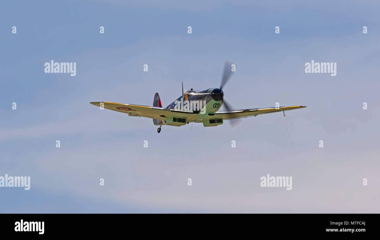 Airplane WWII Spitfire flying at airshow Stock Photo