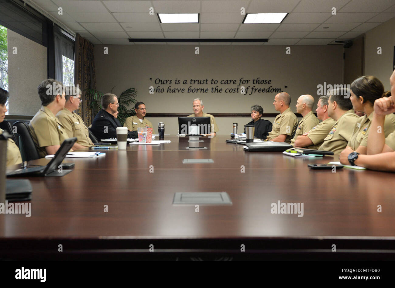 SAN DIEGO (April 24, 2017) Rear Adm. Paul Pearigen, commander of Navy Medicine West, briefs members of the Naval Medical Center San Diego (NMCSD) Executive Steering Committee. Pearigen toured NMCSD before holding an Admiral’s call and answering Sailor’s questions. Stock Photo