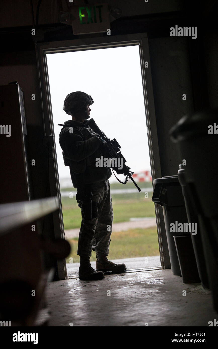 A 75th Security Forces Squadron Airman stands guard at the west ...