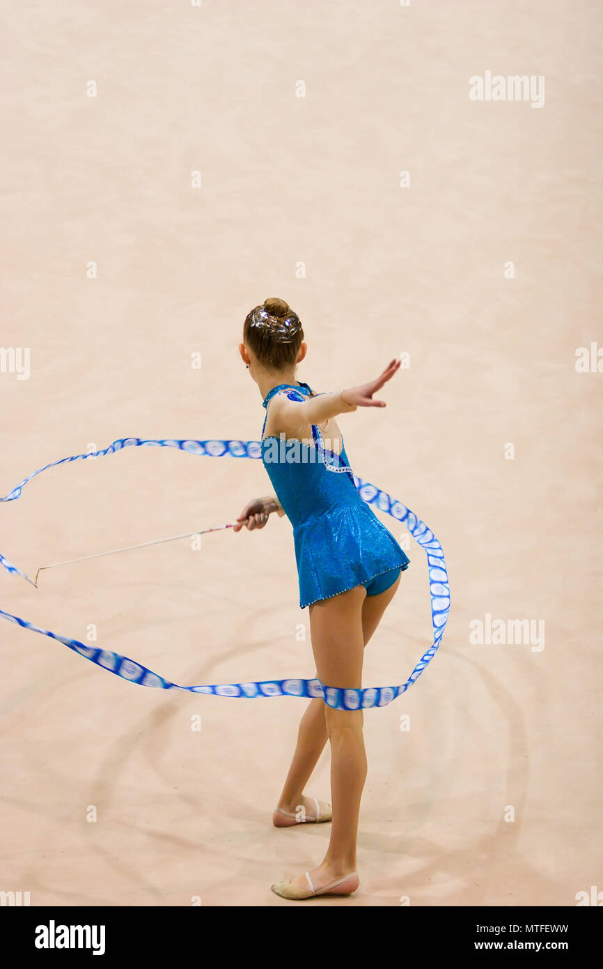 A female competitor in a Rhythmic Gymnastics event Stock Photo