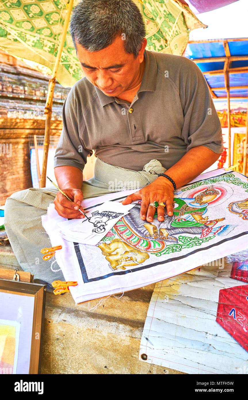 BAGAN, MYANMAR - FEBRUARY 24, 2018: The artist painting an elephant on the piece of paper, on February 24 in Bagan Stock Photo