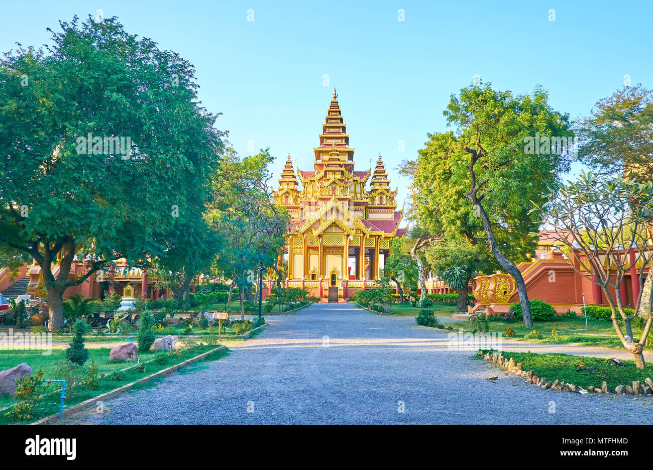 The road to the Great Audience Hall of Golden Palace surrounded with beautiful garden, Bagan, Myanmar Stock Photo