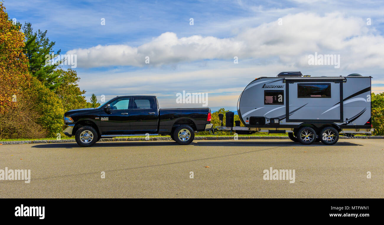 BLUE RIDGE MOUNTAINS, NC, USA-16 OCTOBER 17:  A Ram 2500 pickup towing a Camplite 16DBS travel trailer at an overlook on the Blue Ridge Parkway. Stock Photo