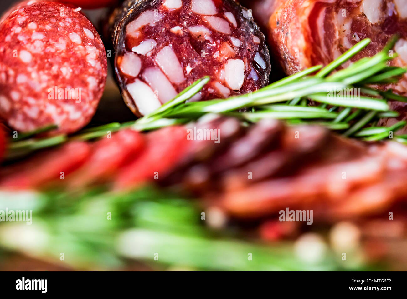 Three types of salami with herbs and peppercorn Stock Photo Alamy