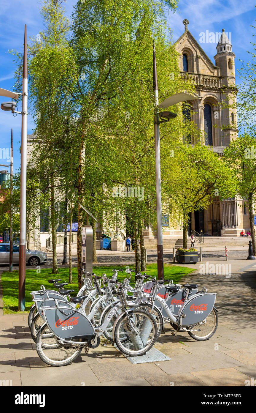 Belfast Bikes in Cathedral Quarter, Belfast. St. Anne's Cathedral is in the background Stock Photo