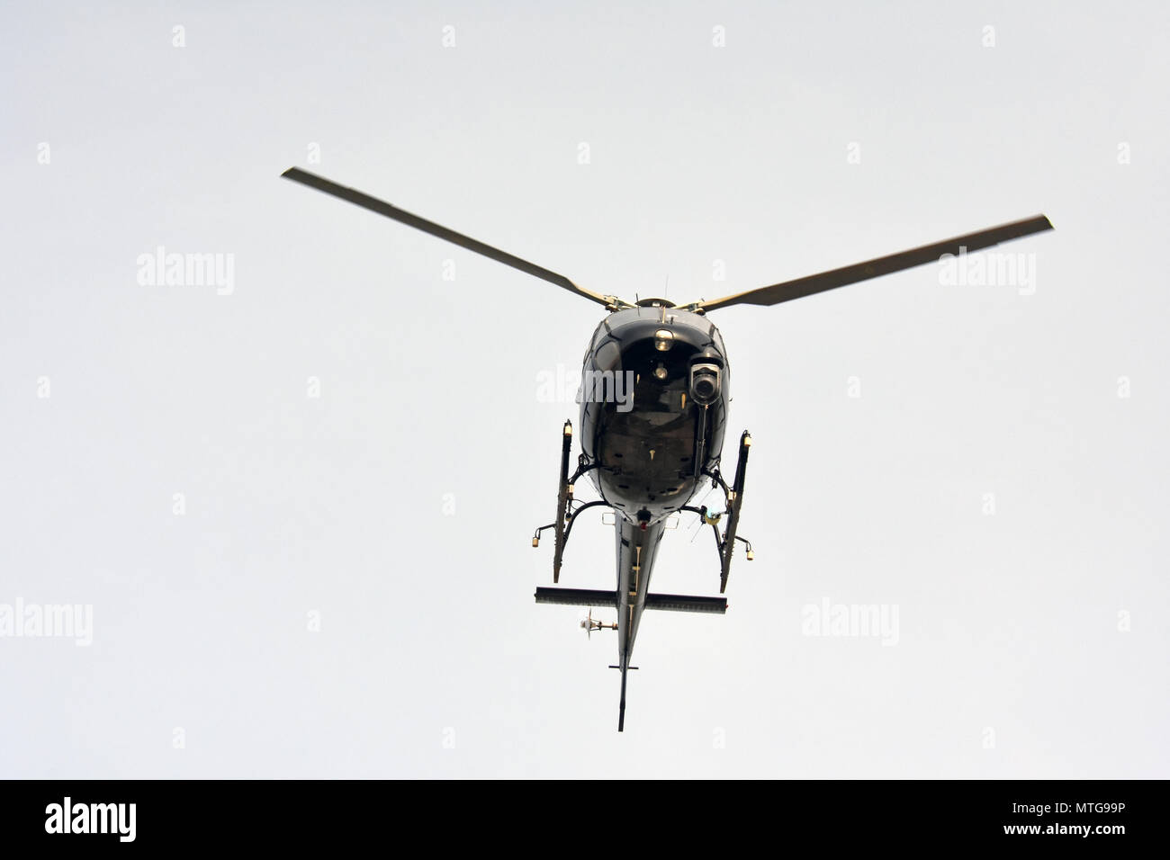 Helicopter in mid air Stock Photo