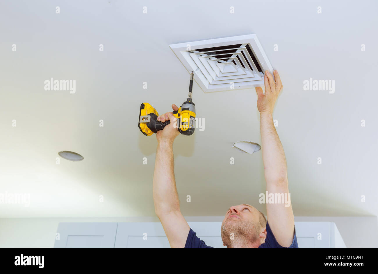 Man installing of HVAC, heating ventilating and cooling after replacing