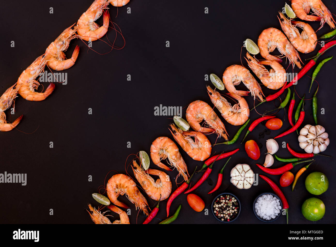 Perfect cooked prawns shrimps with herbs, spices and text space note