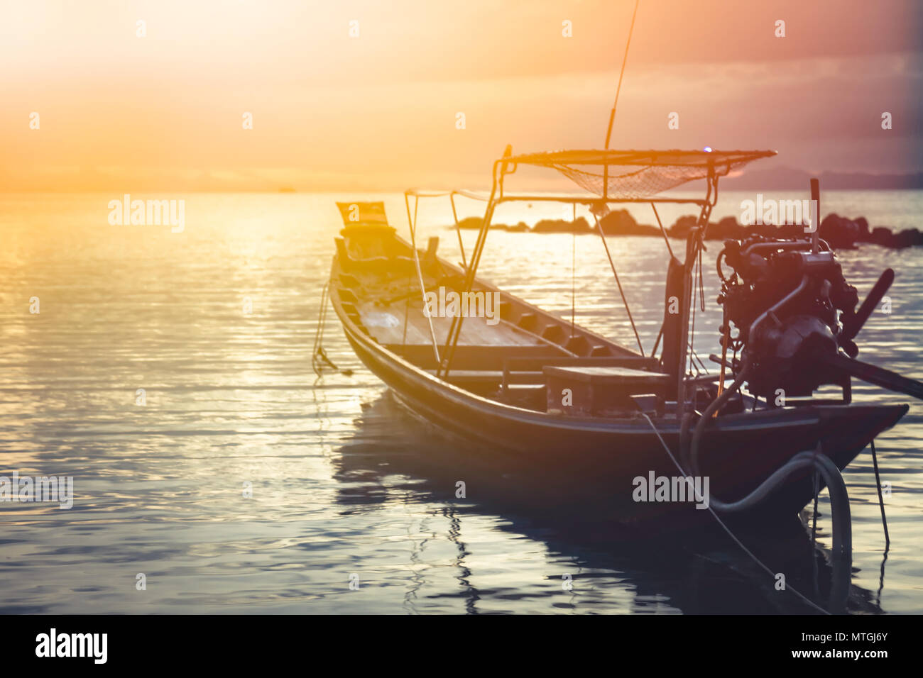 Asia lifestyle landscape sea sunset boat horizon orange sky Stock Photo
