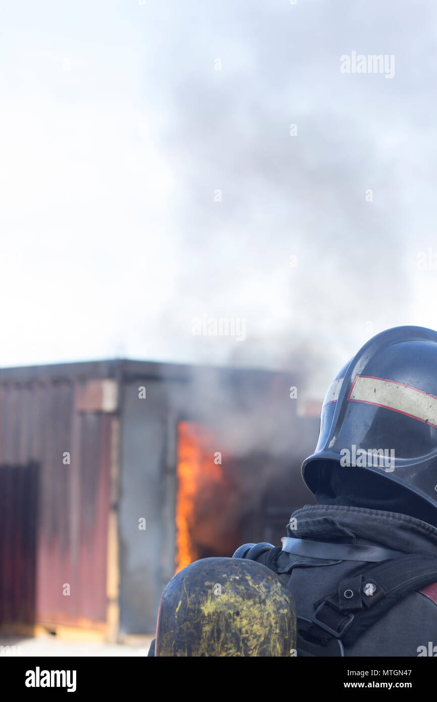 Firefighter putting out fire training station extinguisher backdraft ...