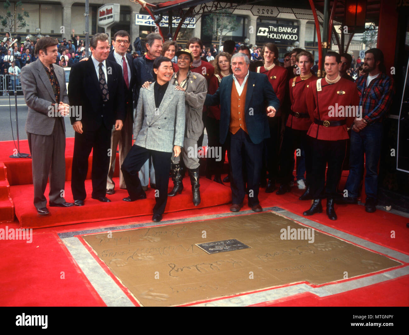 HOLLLYWOOD, CA - JUNE 12: (L-R) Actors Walter Koenig, William Shatner, Leonard Nimoy, DeForest Kelley, George Takei, Nichelle Nichols and James Doohan attend The Cast of 'Star Trek' Hand and Footprint Ceremony on June 12, 1991 at Mann's Chinese Theatre in Holllywood, California. Photo by Barry King/Alamy Stock Photo Stock Photo