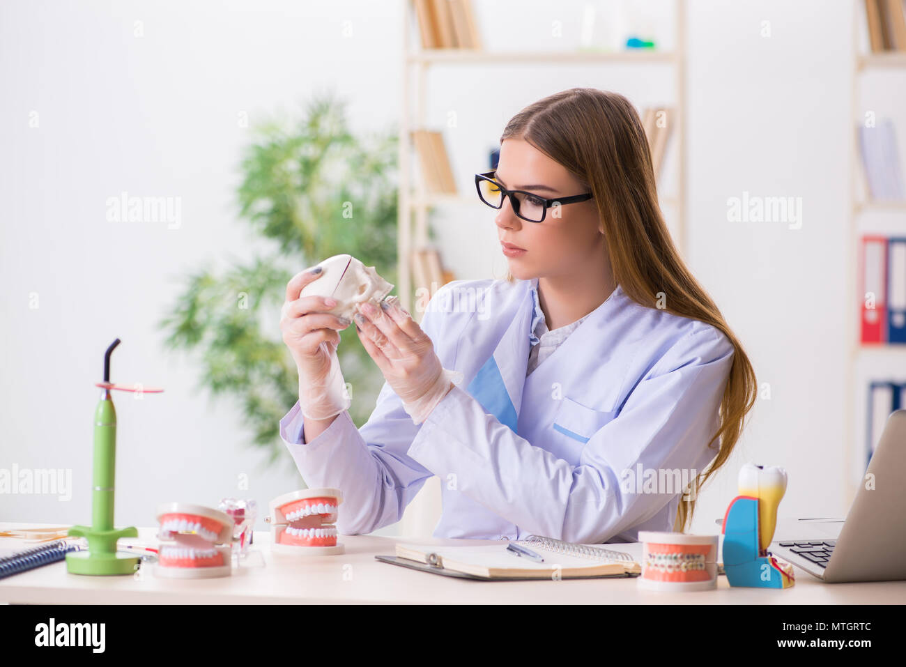 Dentistry student practicing skills in classroom Stock Photo - Alamy