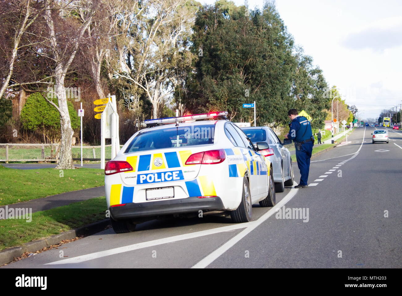 Bulls, New Zealand - 2 July 2016: A Police officer pulls over a speeding driver on the main road of Bulls in New Zealand. Stock Photo