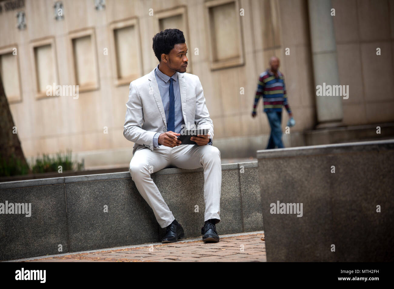 Business man working on tablet Stock Photo