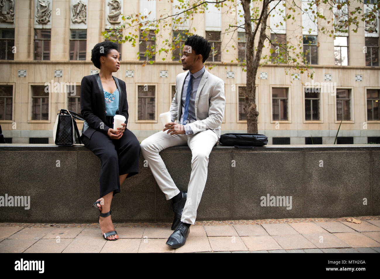 Business man and woman having coffee Stock Photo
