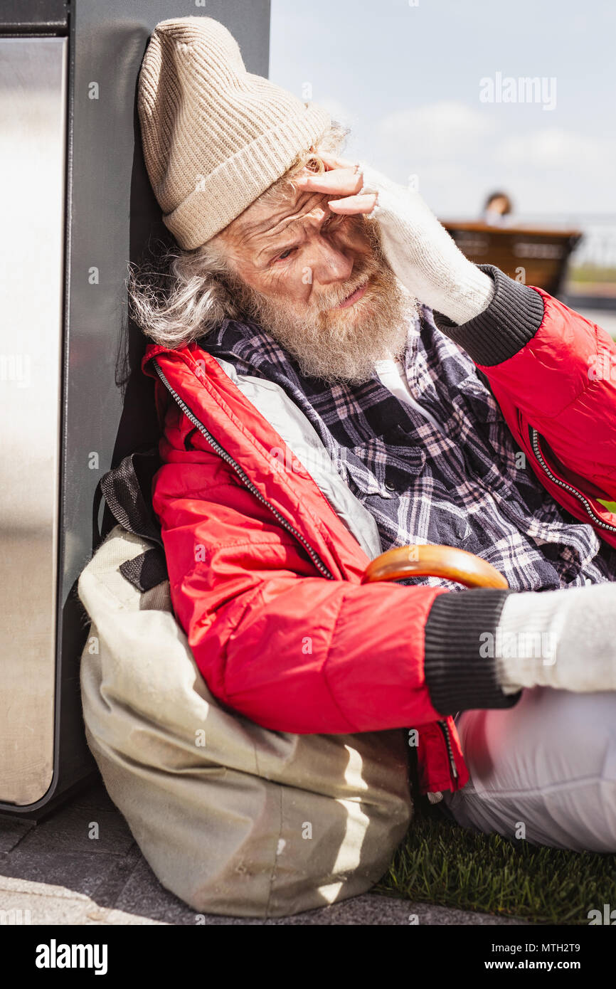 Unhappy bearded man feeling depressed Stock Photo