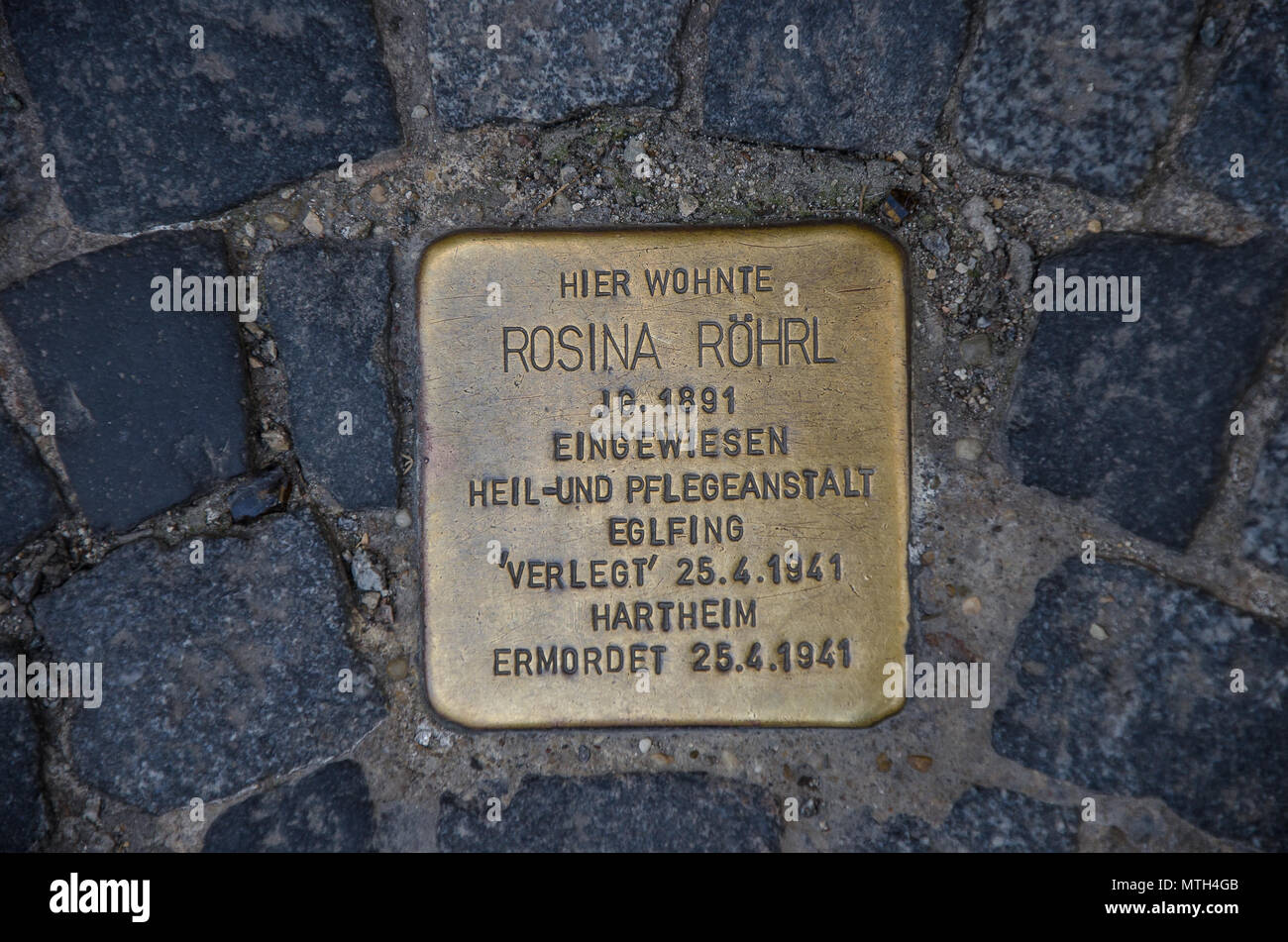 Stumbling stones remind us of the names of people who fell victim to Nazi terror.In order to keep the memory of them alive, Stock Photo