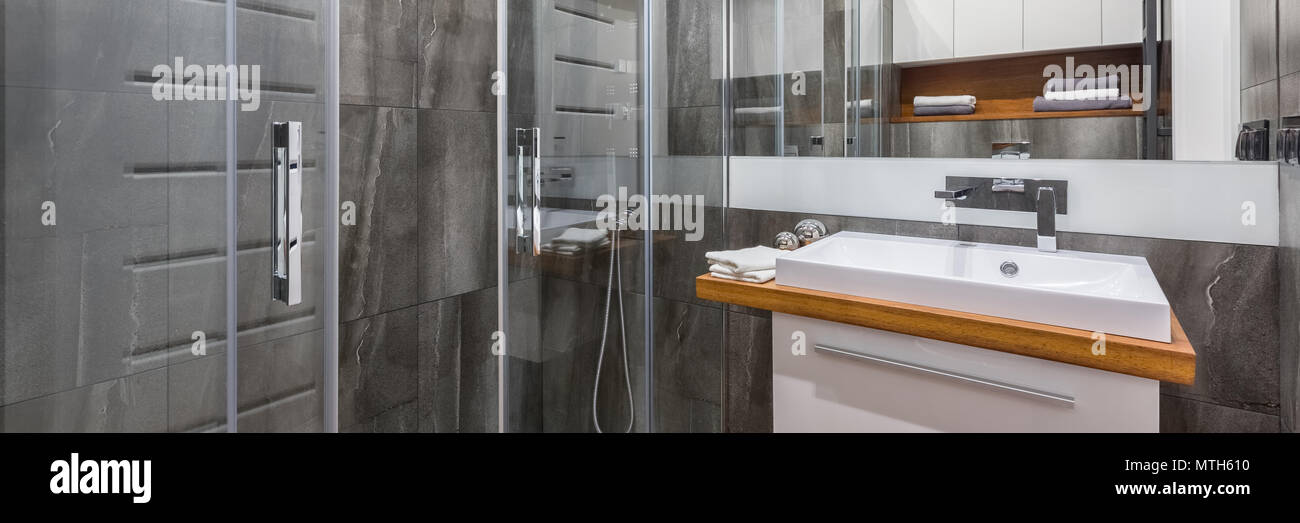 Gray Bathroom With Shower Cabinet Basin And Mirror Panorama