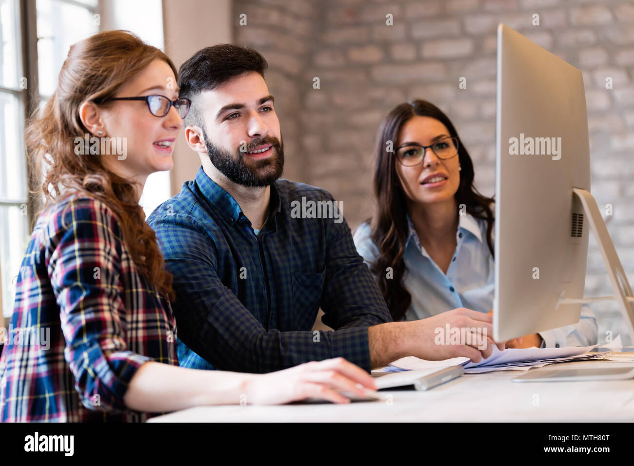 Young architects working on project in office Stock Photo