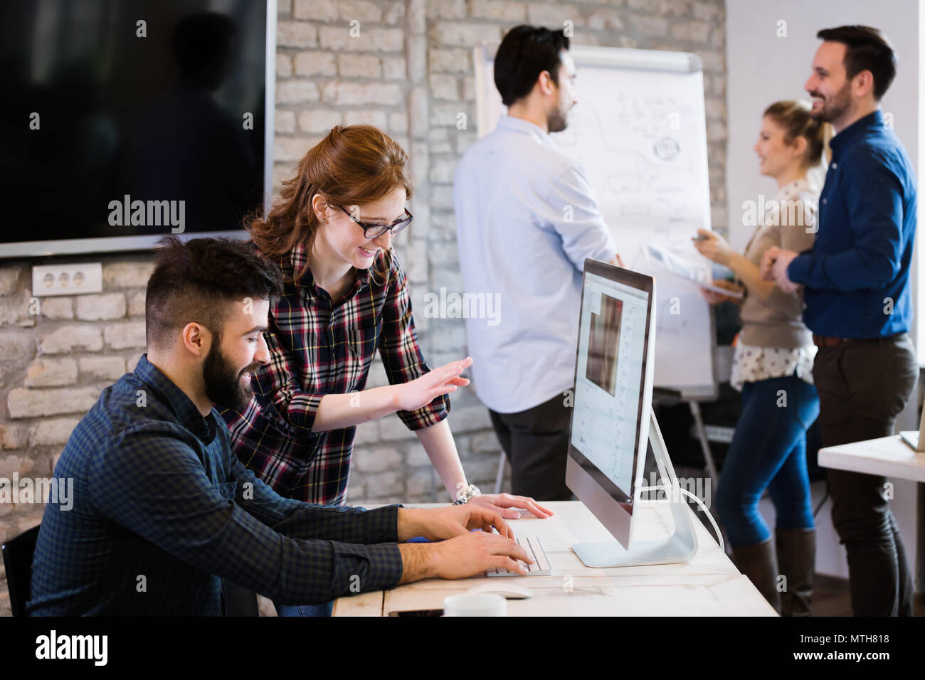Young architects working on project in office Stock Photo