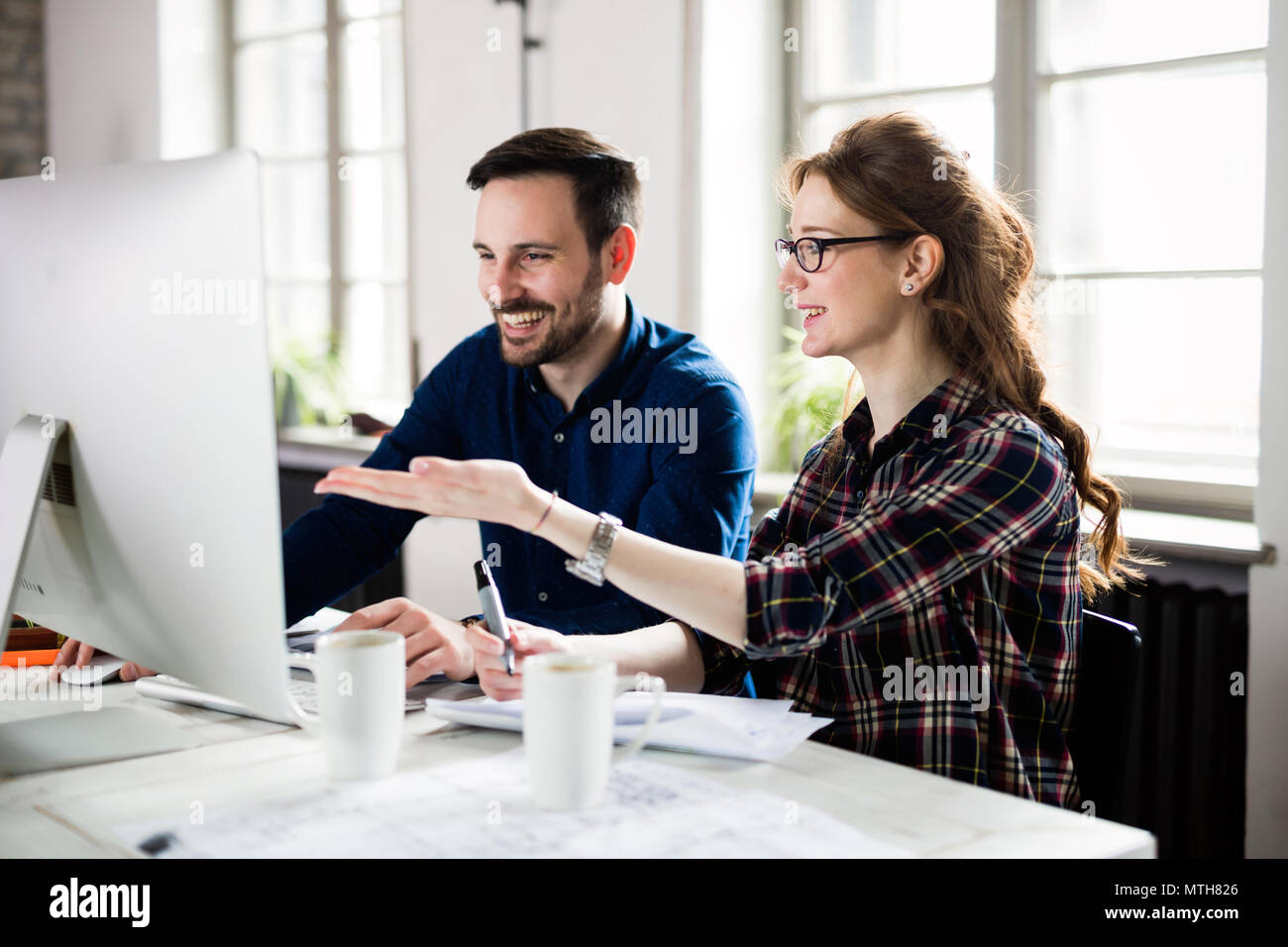 Young architects working on project in office Stock Photo