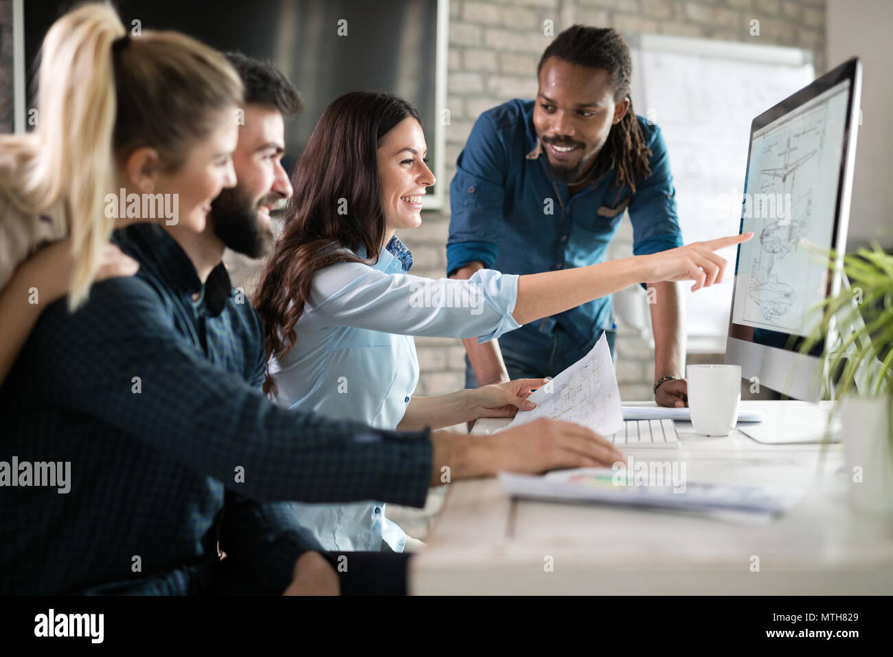 Young architects working on project in office Stock Photo